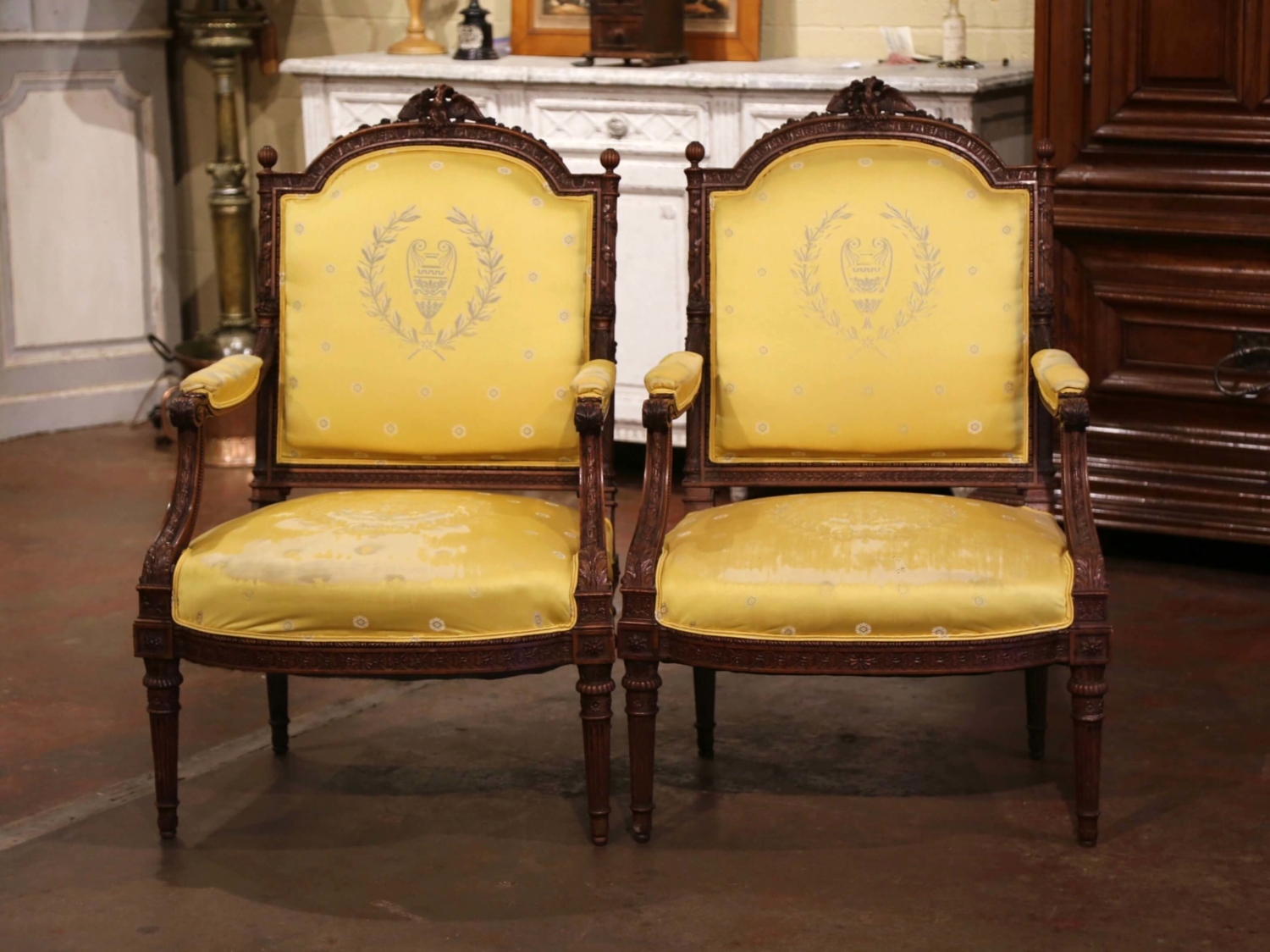 At Auction: A pair of Louis XVI style walnut framed tub chairs